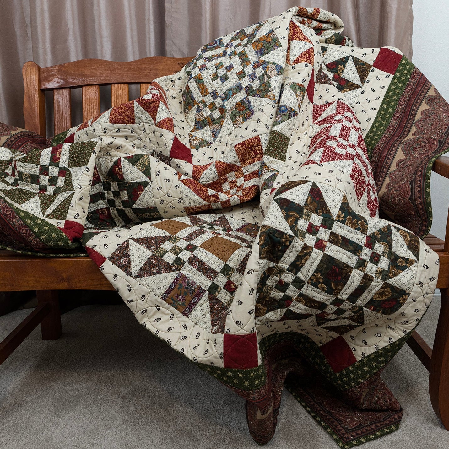 Missouri print quilt laid out on a wooden bench