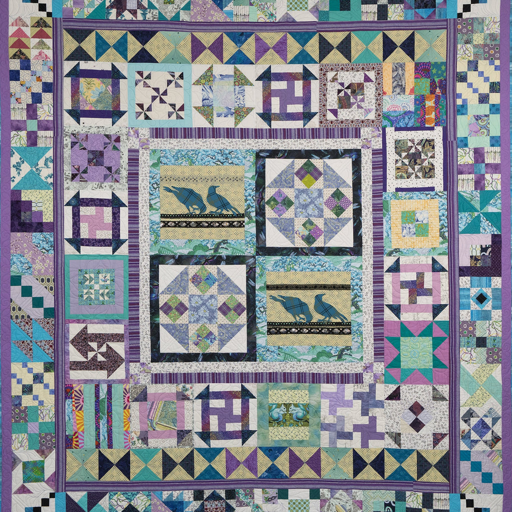 Colorful quilt with geometric patterns and bird designs