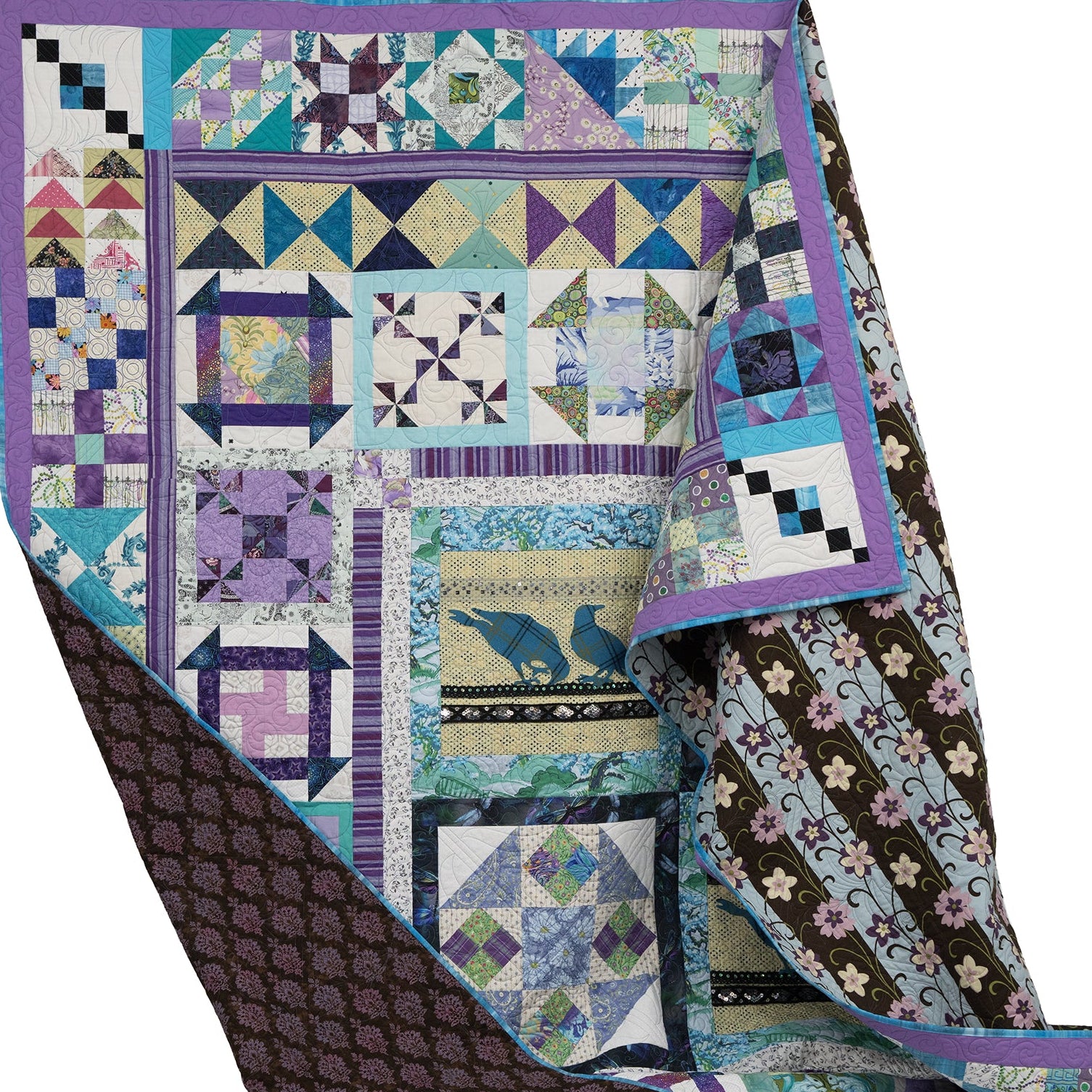 Colorful quilt with geometric patterns on a white background
