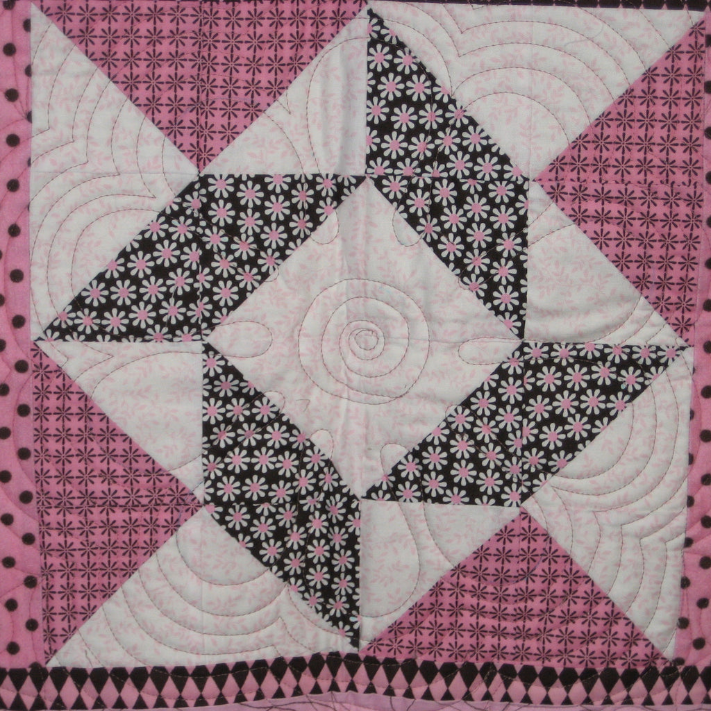 Wall hanging block in a floral geometric print in pink and brown