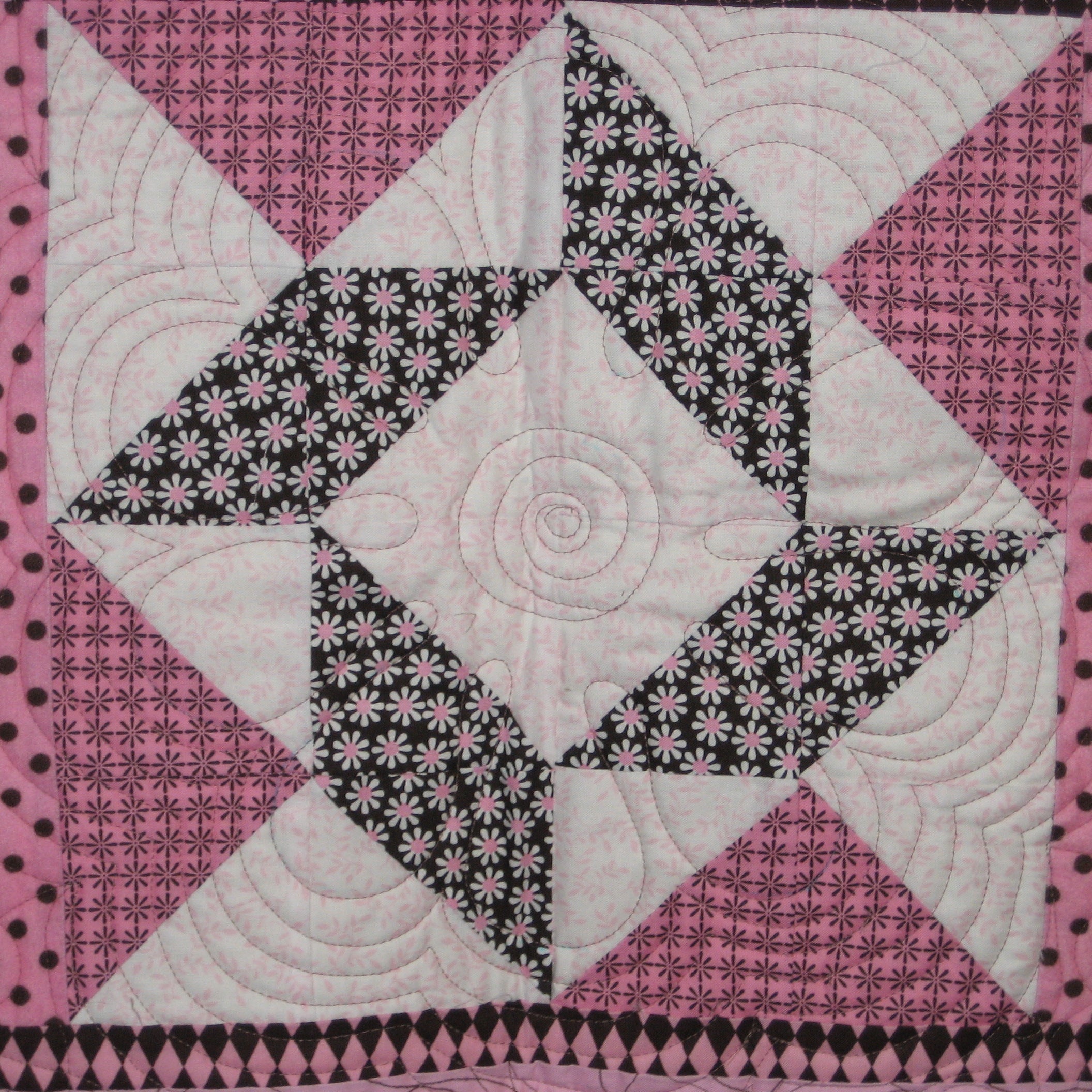 Wall hanging block in a floral geometric print in pink and brown