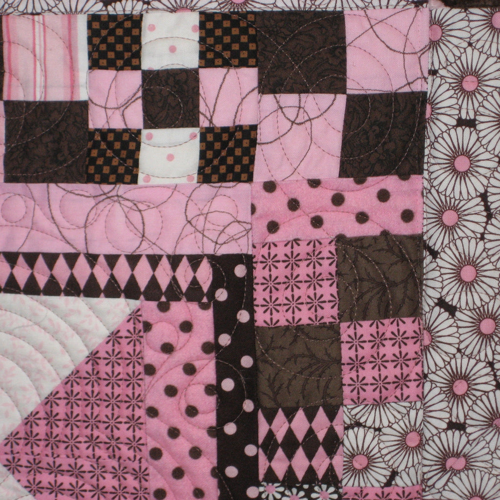Quilt block in pink and brown prints
