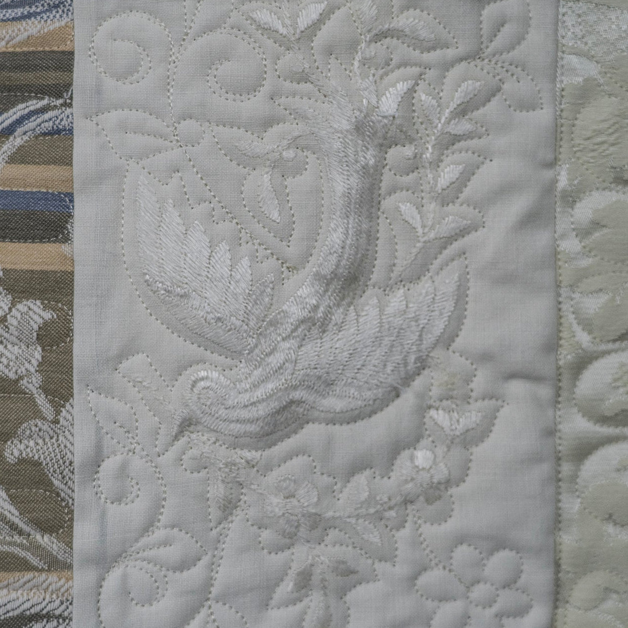 Collage of textured fabric patterns with floral and leaf designs.
