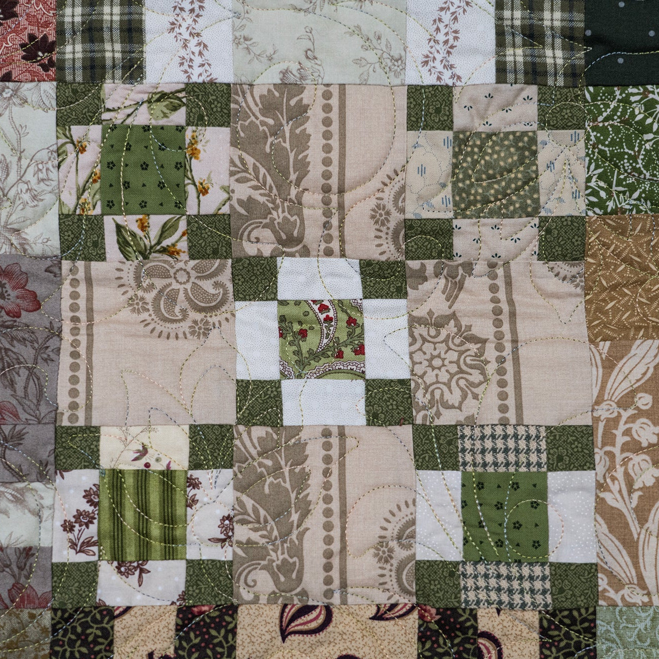 Patchwork quilt with various patterns and colors