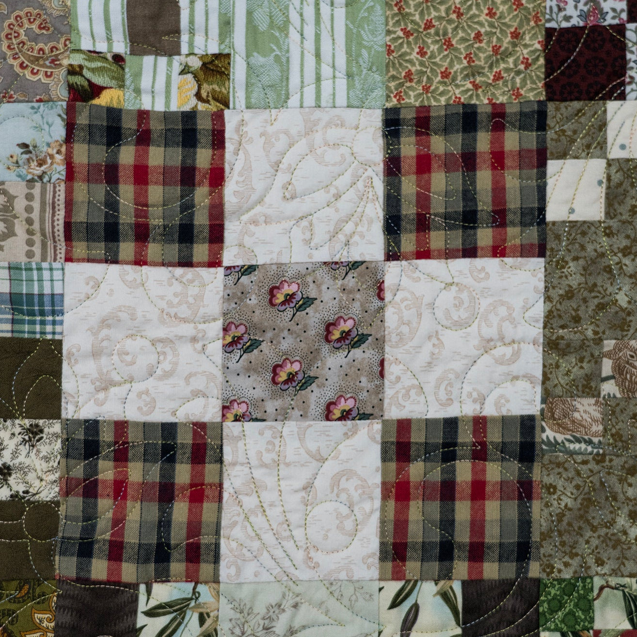 Patchwork quilt with various patterns and colors