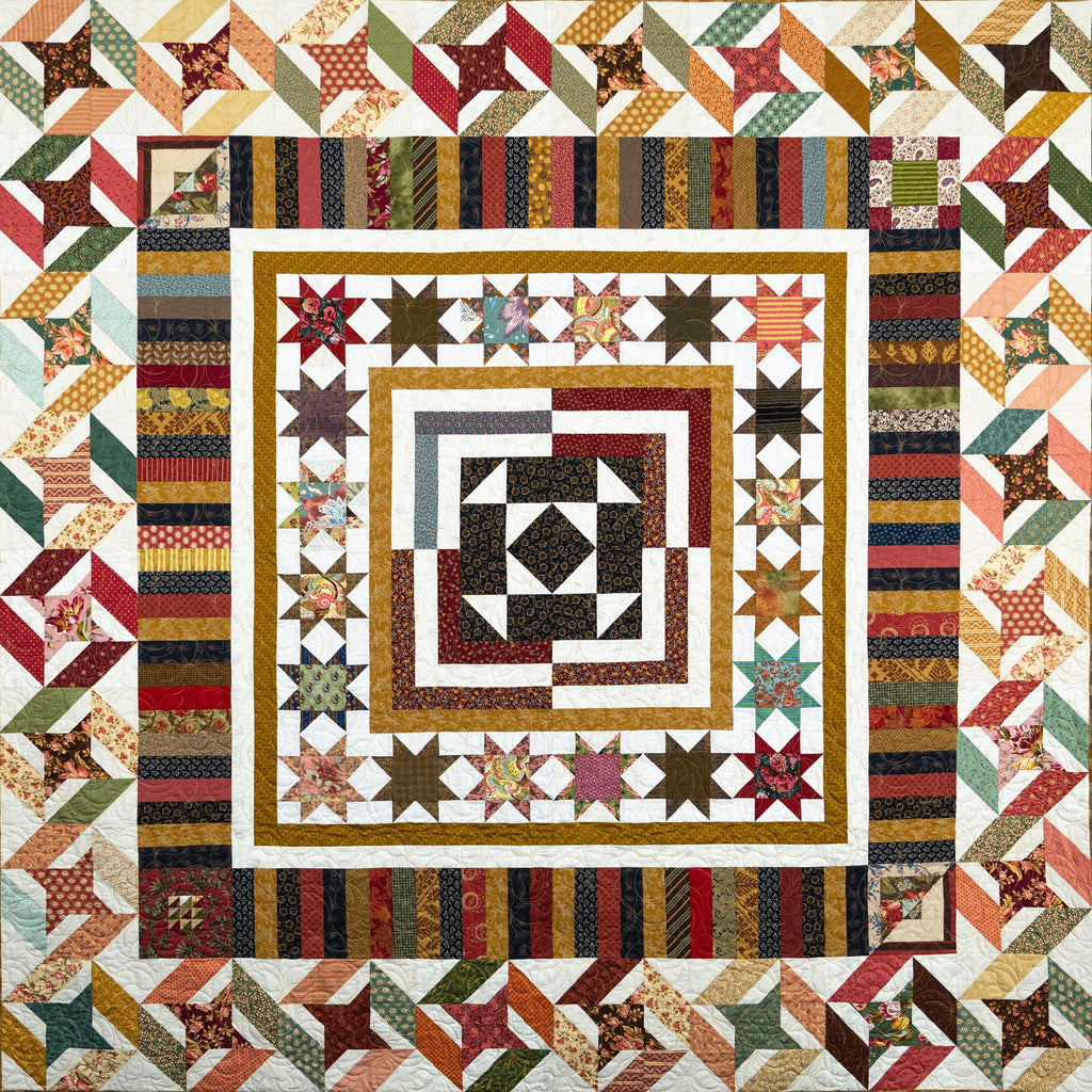 Colorful quilt with geometric patterns and star designs.