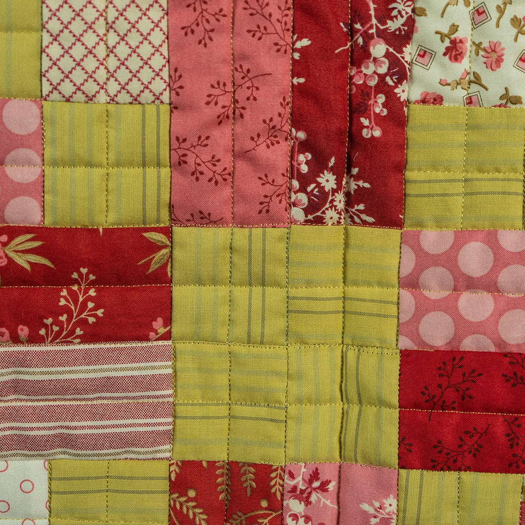 Patchwork quilt with various patterns and colors