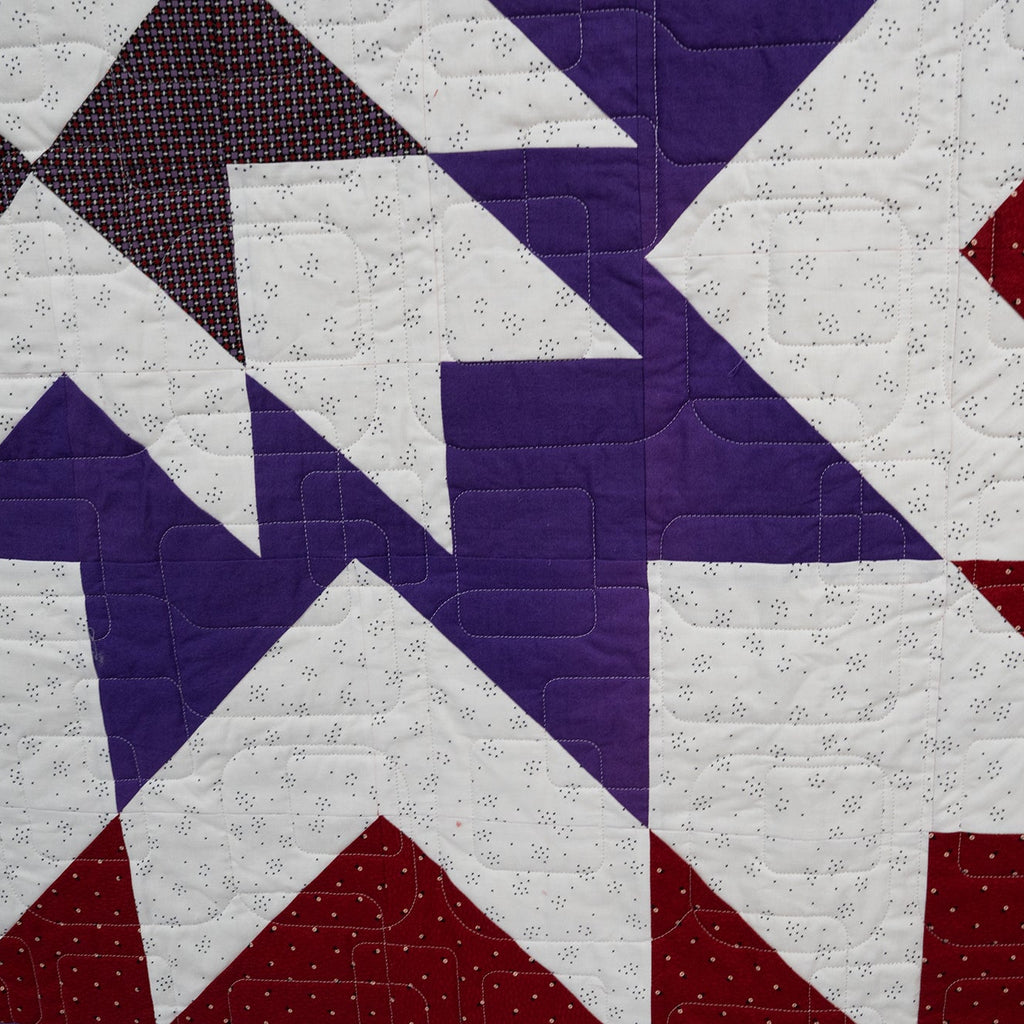 Quilt with star pattern in red, white, and blue