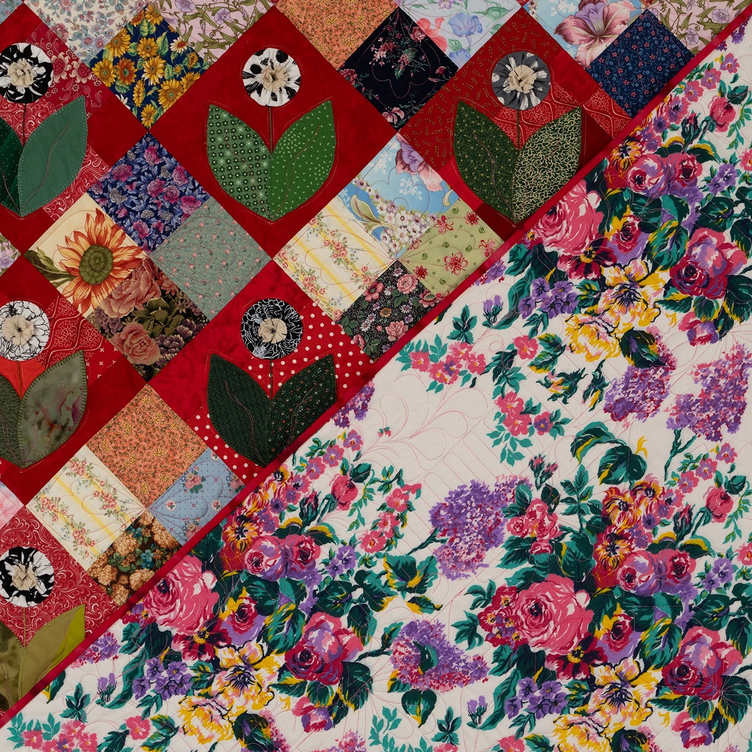 Colorful floral patchwork quilt with a variety of patterns and colors.