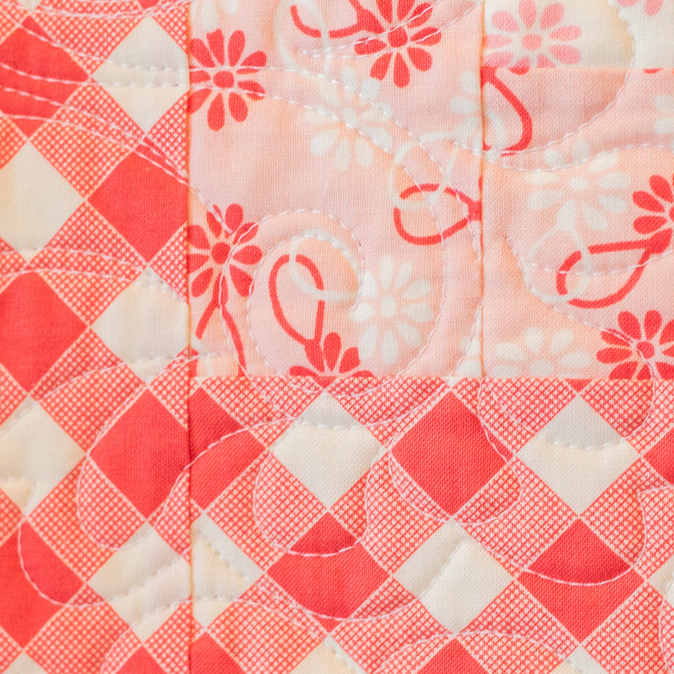 Quilt with red and white floral patterns