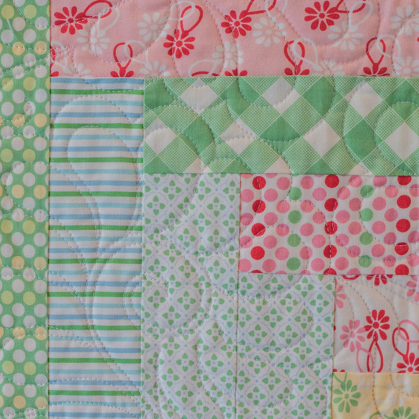 Patchwork quilt with various patterns and colors