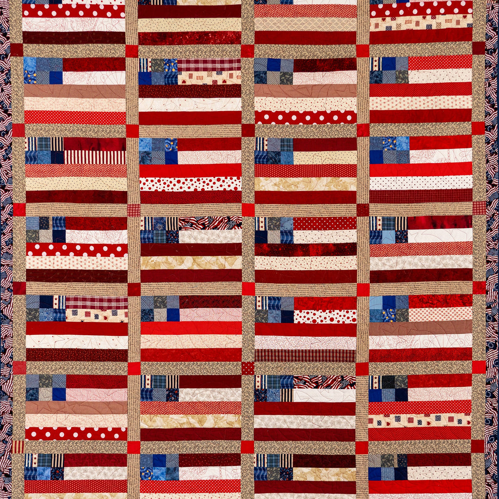 Patchwork quilt with a pattern resembling American flags on a plain background