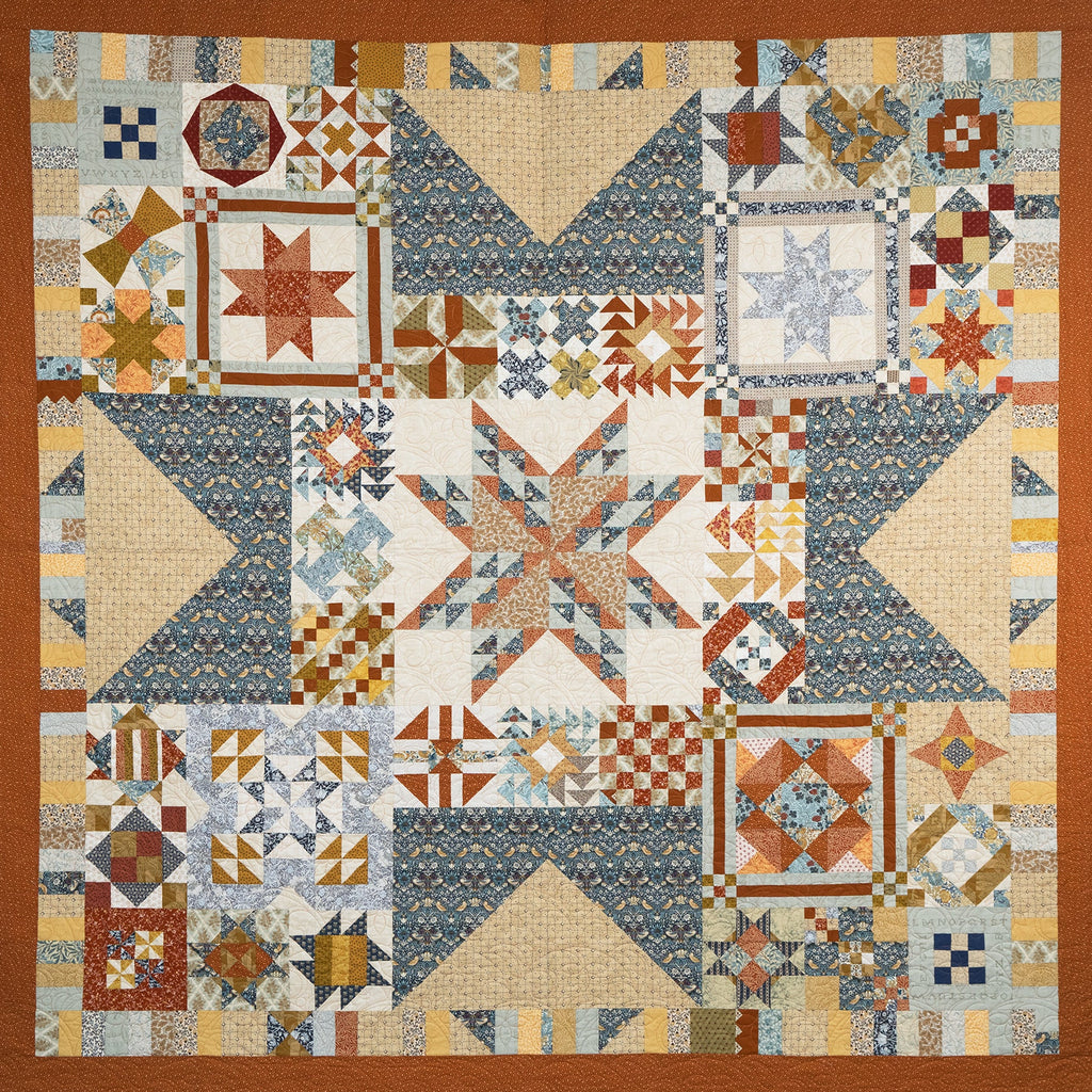 Quilt with geometric pattern in various colors on a brown border