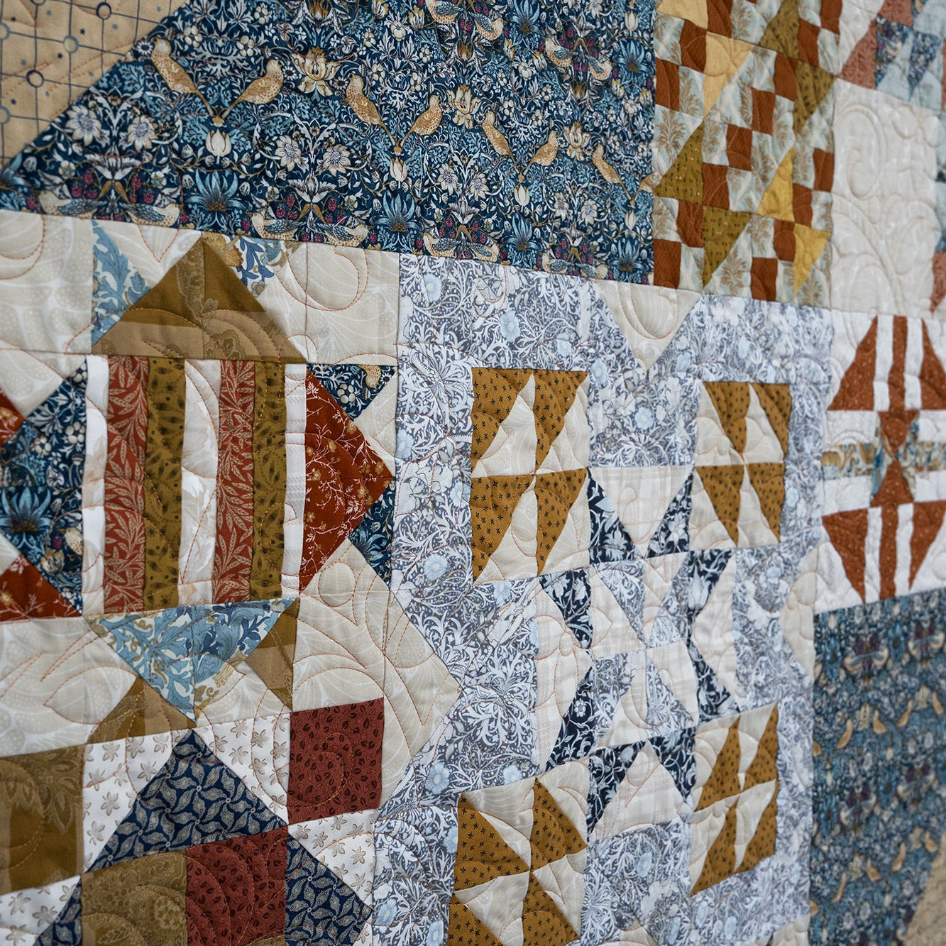 Quilt with various geometric patterns and colors