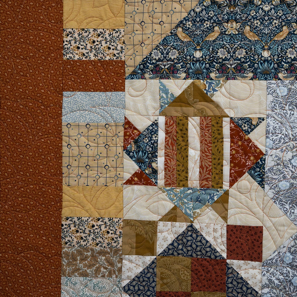 Patchwork quilt with various patterns and colors