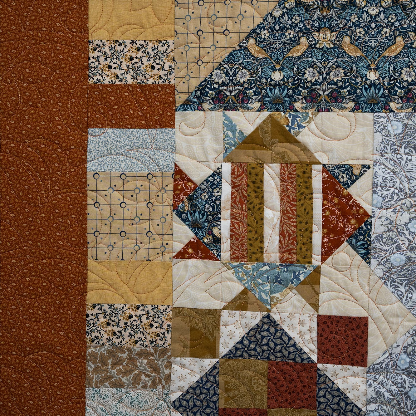 Patchwork quilt with various patterns and colors