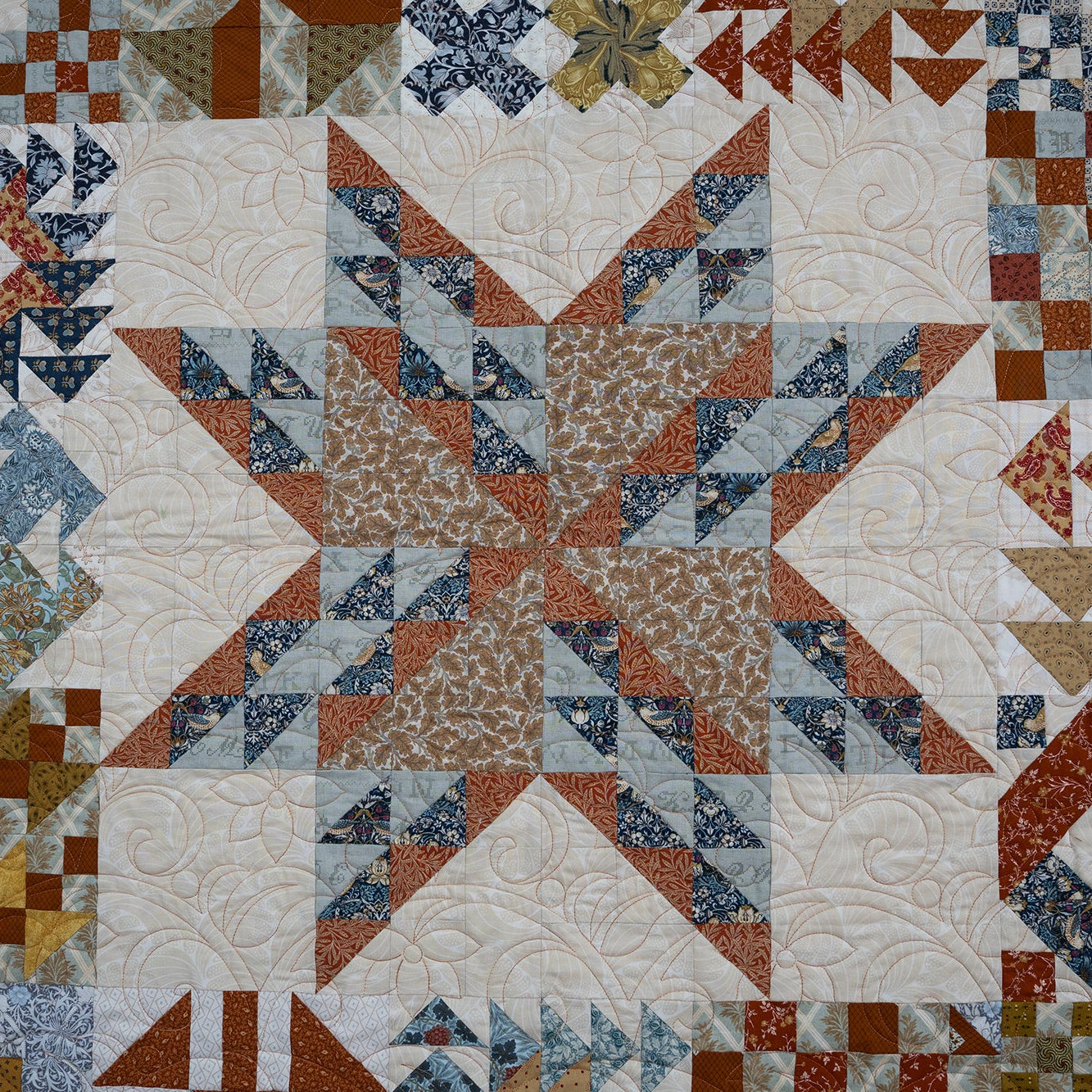 Quilt with geometric pattern in various colors