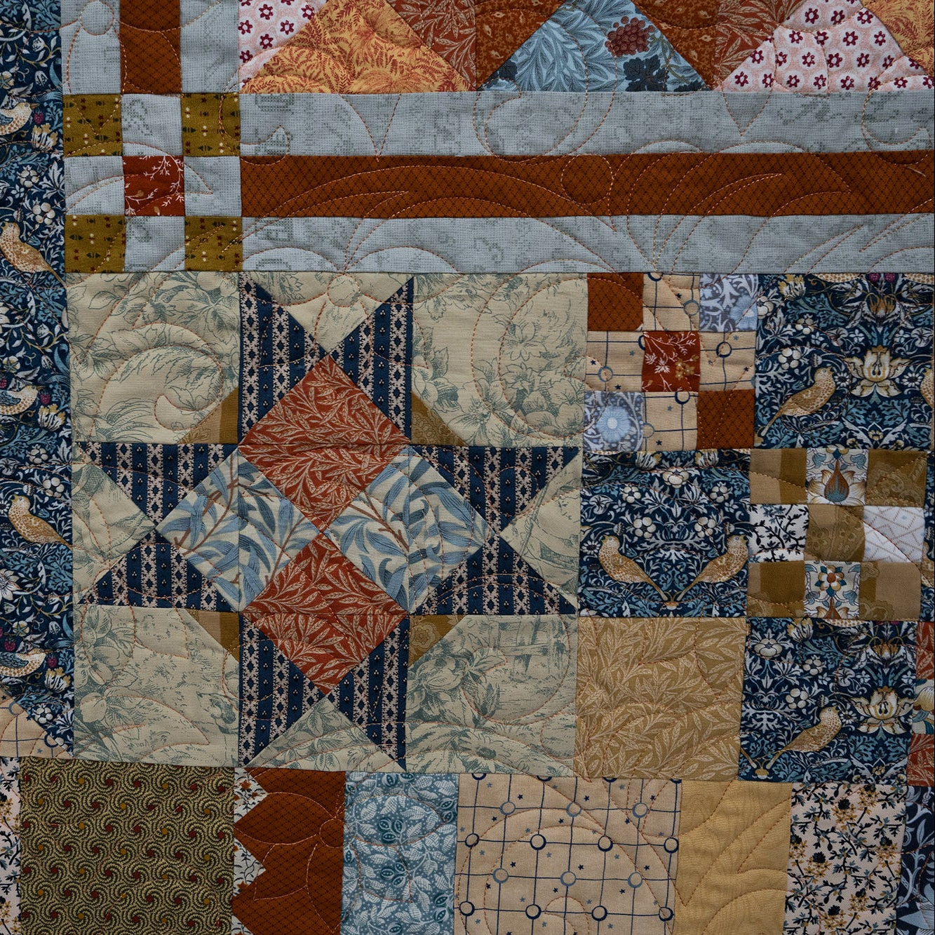 Patchwork quilt with various patterns and colors
