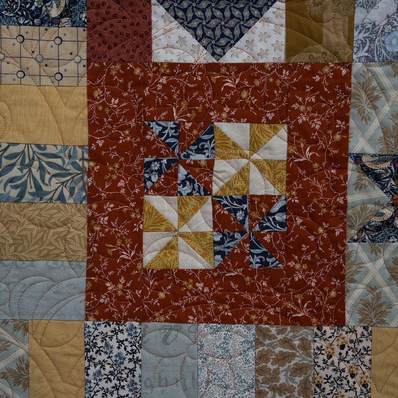Patchwork quilt with various patterns and colors