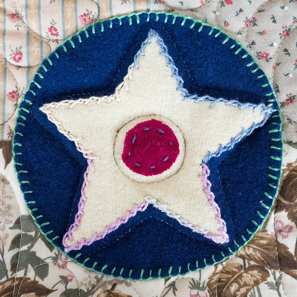 Patch with star design on a floral fabric background