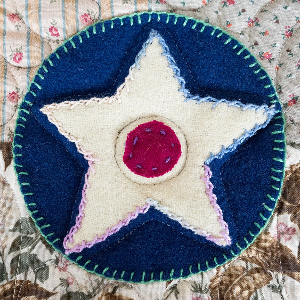 Patch with star design on a floral fabric background