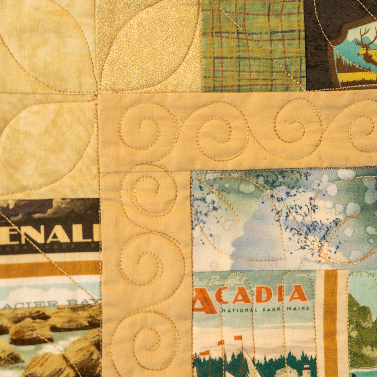 Quilt with patchwork design featuring scenic images and text