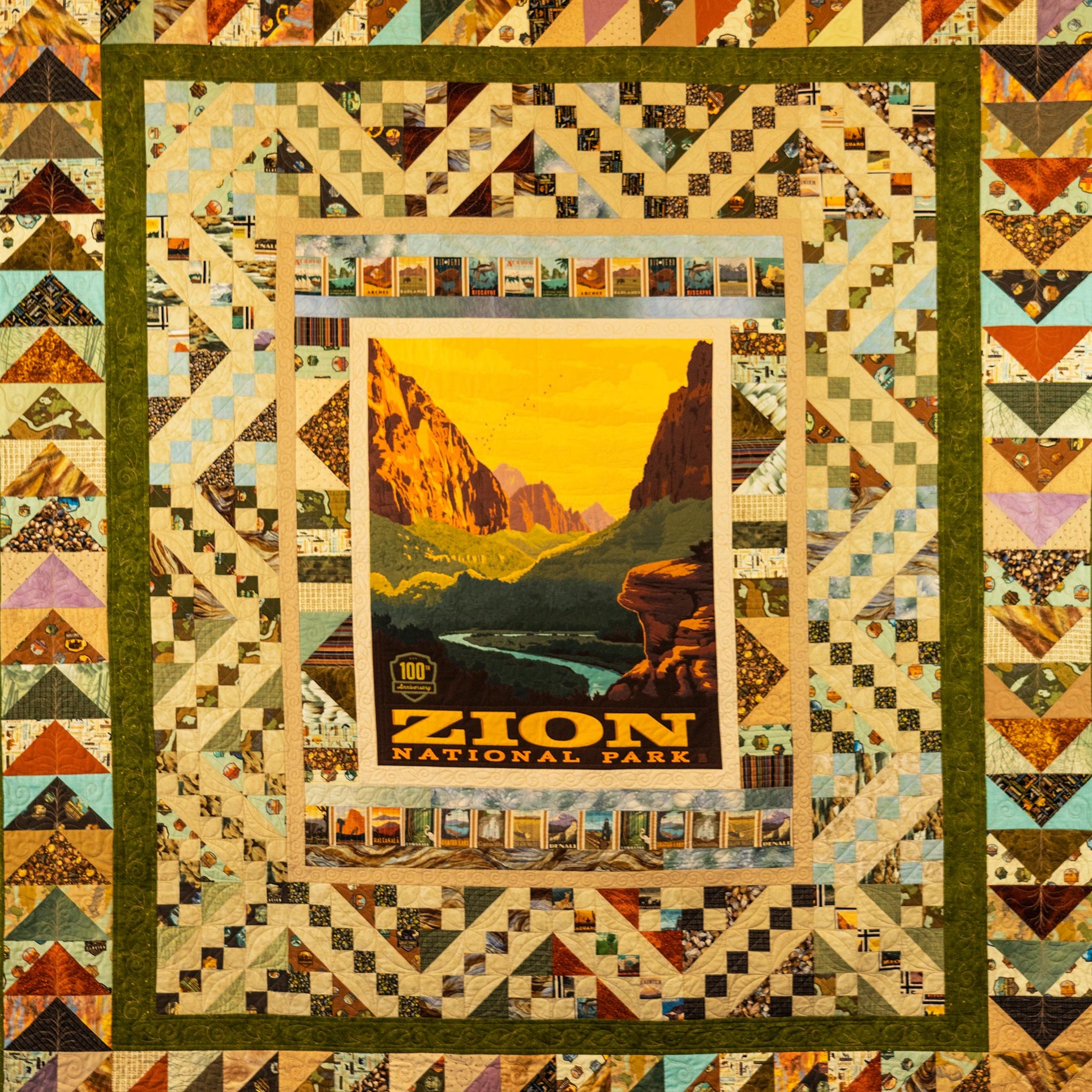 Quilt with a framed image of Zion National Park and geometric border